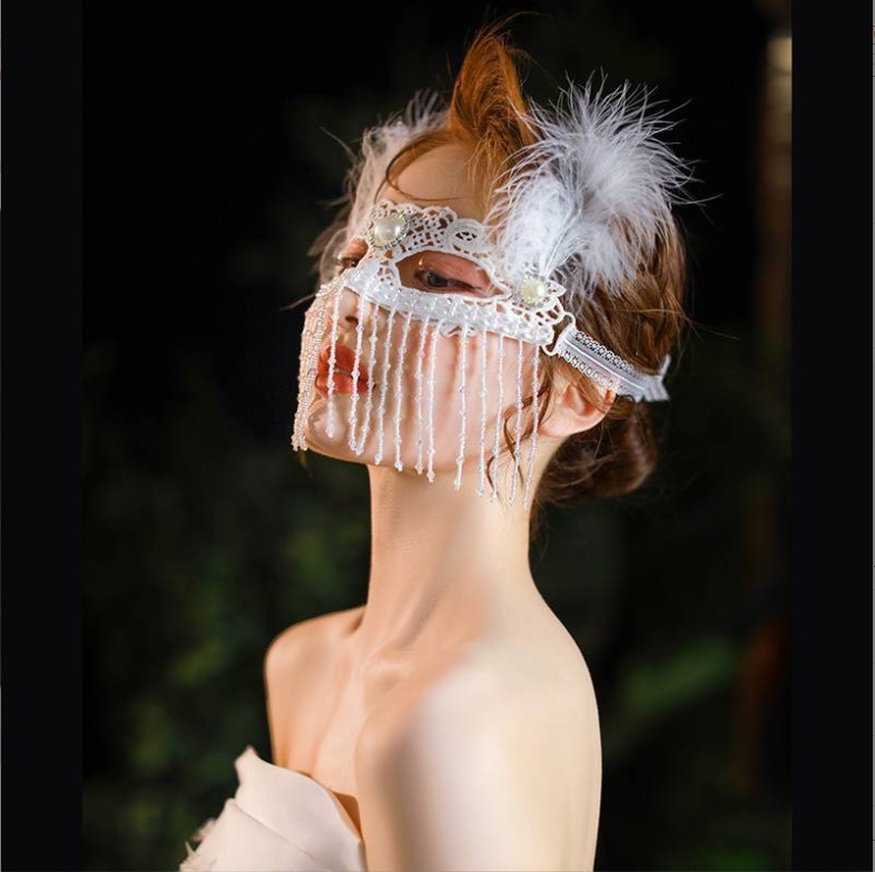 Elegant Masquerade Mask With White Feather and Pearl Accents